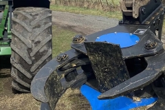 Clamp attached to tractor