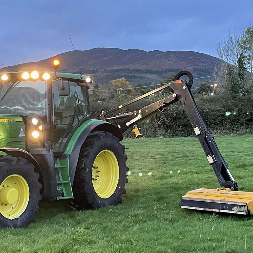 John Deere tractor with McConnel hedge cutting equipment