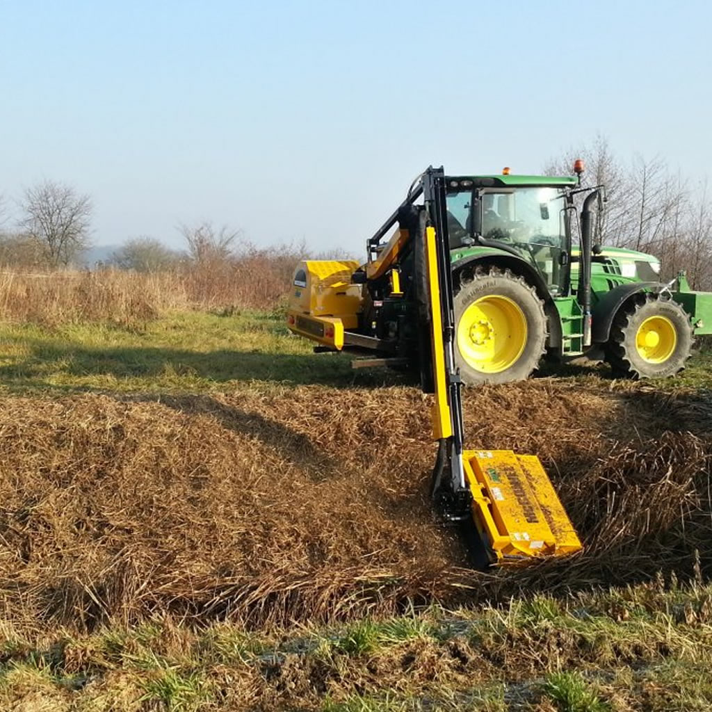 Ditch clearance using power arm