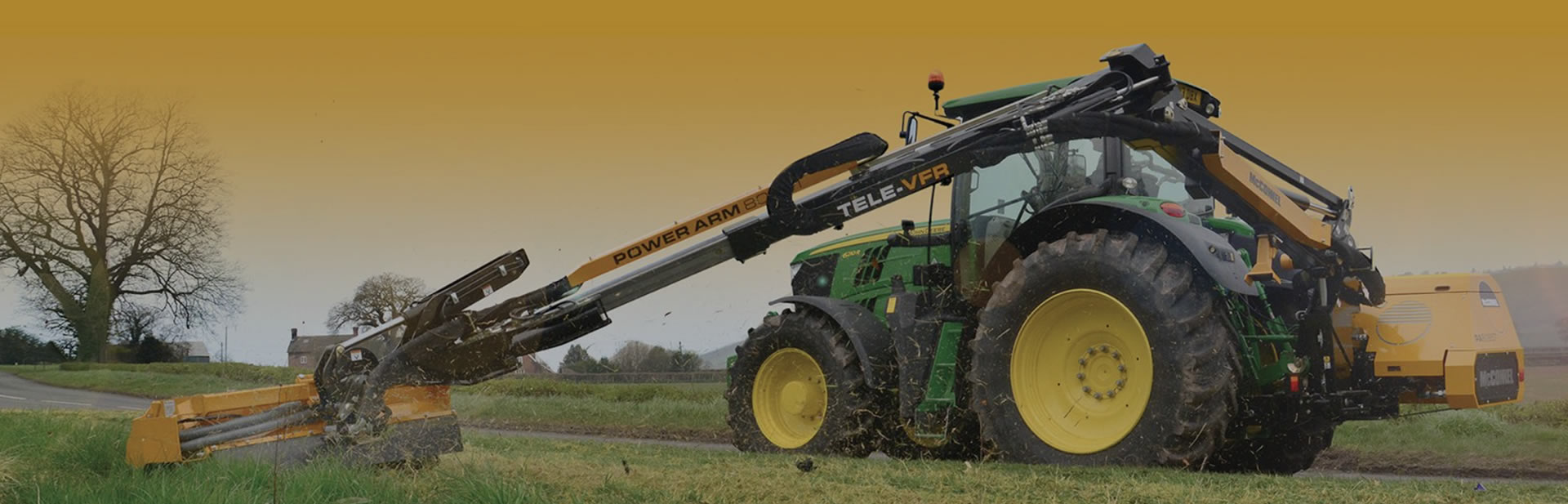 Tractor with flail mower cutting grass in Cheshire