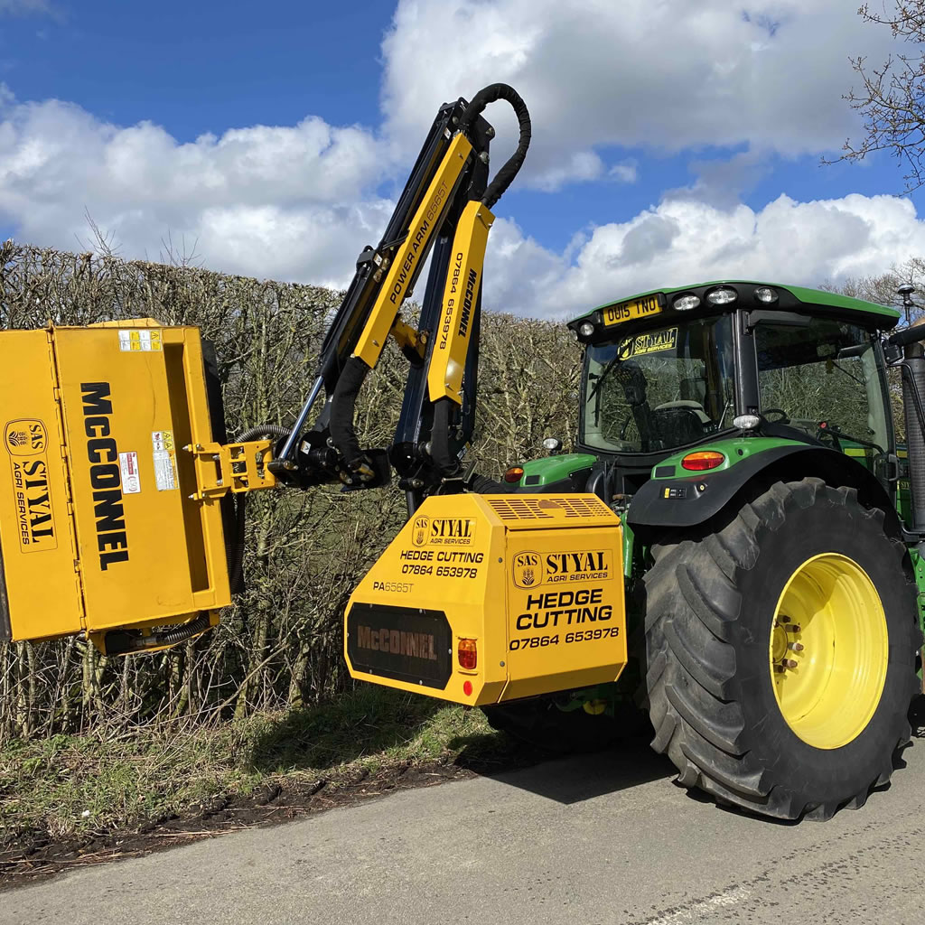 Tractor with power arm